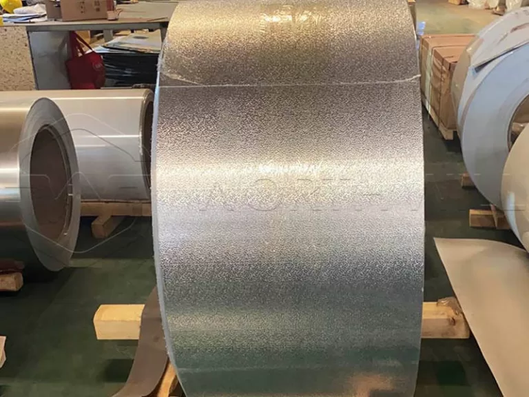 Embossed aluminum coil with stucco pattern